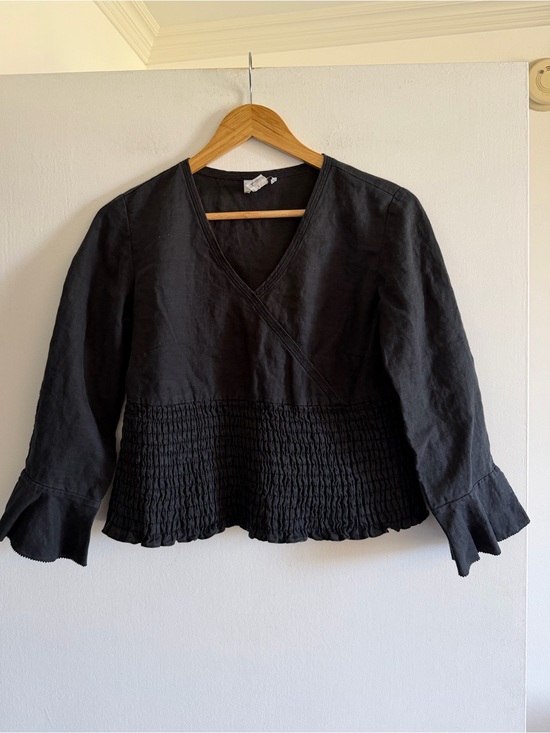 LOFT Tops - Ann Taylor LOFT Black Linen Smocked Crossover Peplum Sleeve Blouse size 2 EUC